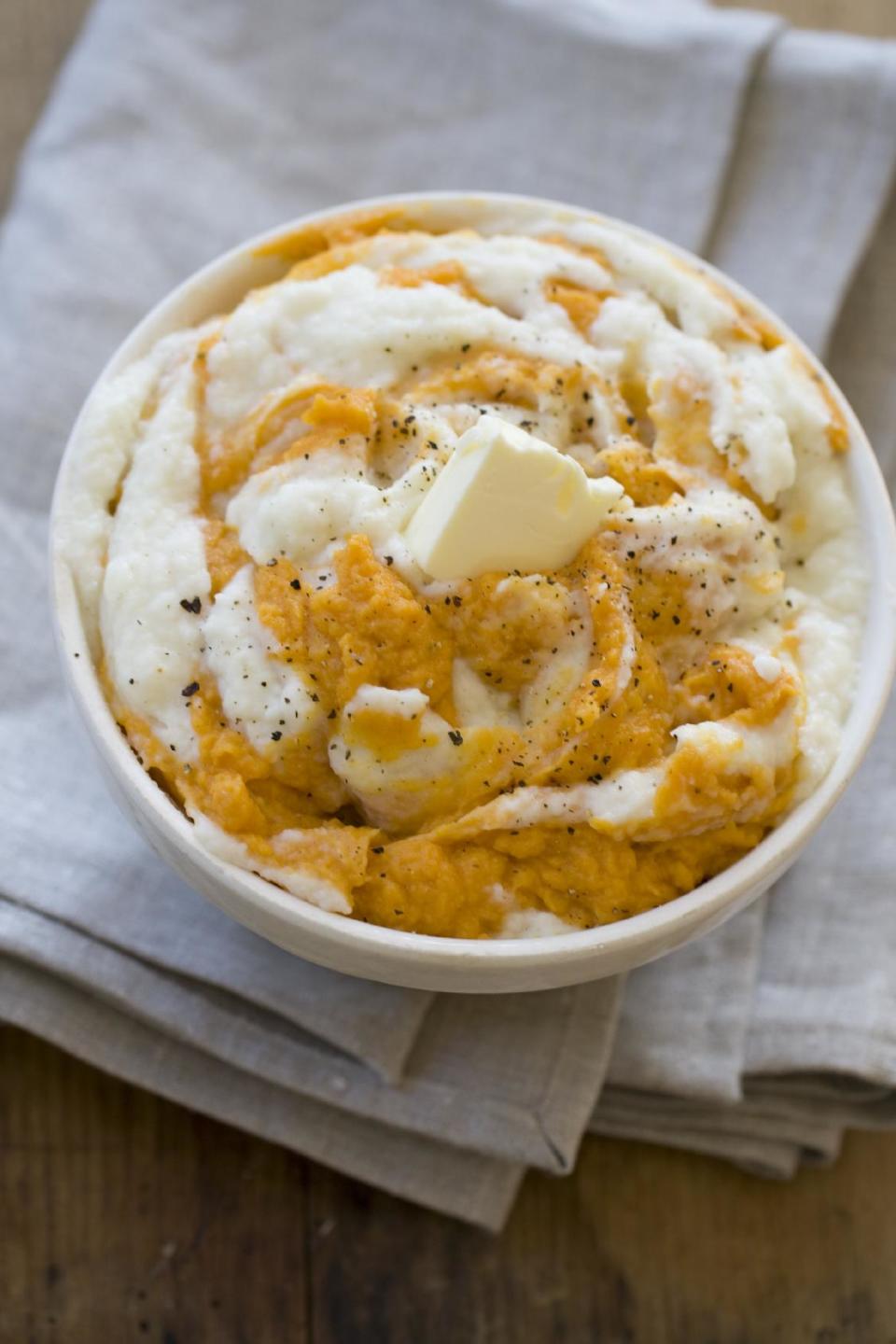 This Oct. 14, 2013 photo shows orange sweet potatoes swirled with Parmesan cauliflower puree in Concord, N.H. (AP Photo/Matthew Mead)