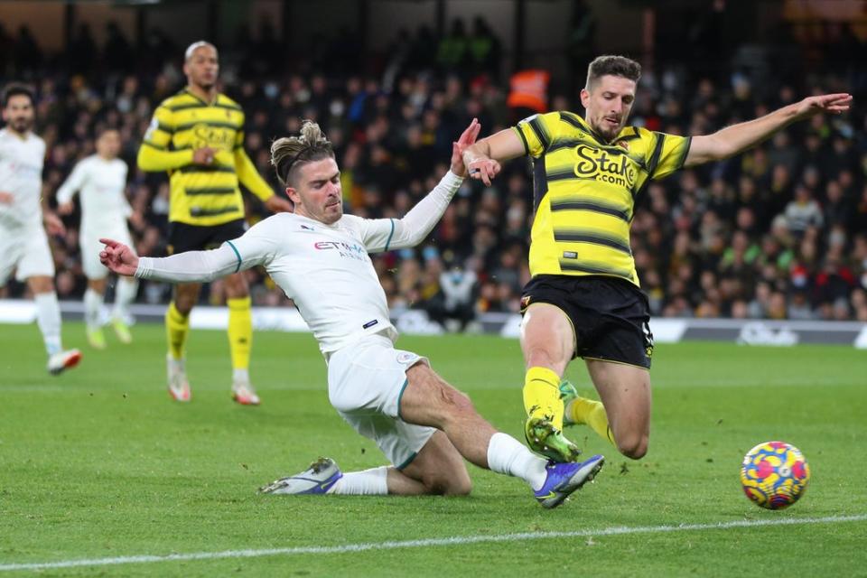 Grealish attempts to get a shot away under pressure from Craig Cathcart (Manchester City FC)