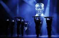 The cast performs during a photocall for a new production of "Miss Saigon" at the Prince Edward Theatre in London May 19, 2014. The production marks the 25th anniversary of the musical by Claude-Michel Schonberg and Alain Boubil. REUTERS/Luke MacGregor (BRITAIN - Tags: ENTERTAINMENT)