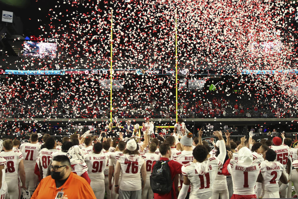 Wisconsin players celebrate after defeating Arizona State in the Las Vegas Bowl NCAA college football game Thursday, Dec. 30, 2021, in Las Vegas. (AP Photo/L.E. Baskow)