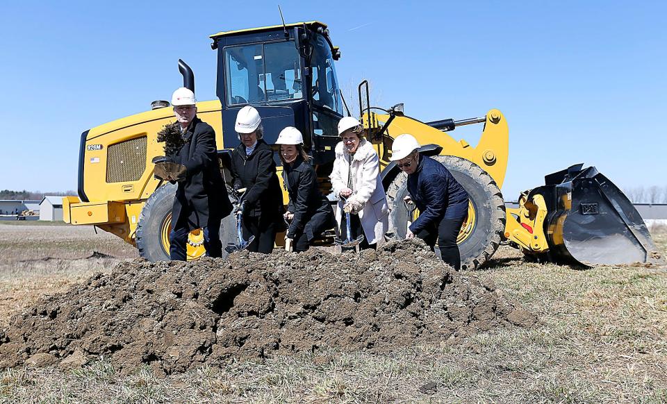 Ashland Community Foundation President Jim Cutright, lead donor Jan Archer, ACCF Chief Program Director Kristin Aspin, Foundations Childcare Center board Chair JoAnn Ford Watson and Women's Fund Chair Brenda Usleton participate in a groundbreaking ceremony Thursday for new child care center on Ford Drive in the Ashland Business Park.