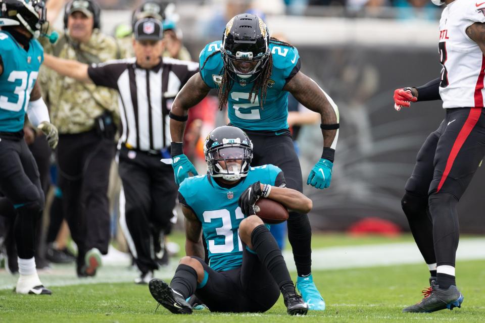 Jaguars safety Rayshawn Jenkins (2) celebrates an interception by Tyson Campbell (32) in the second quarter of Sunday's game against the Atlanta Falcons at TIAA Bank Field.