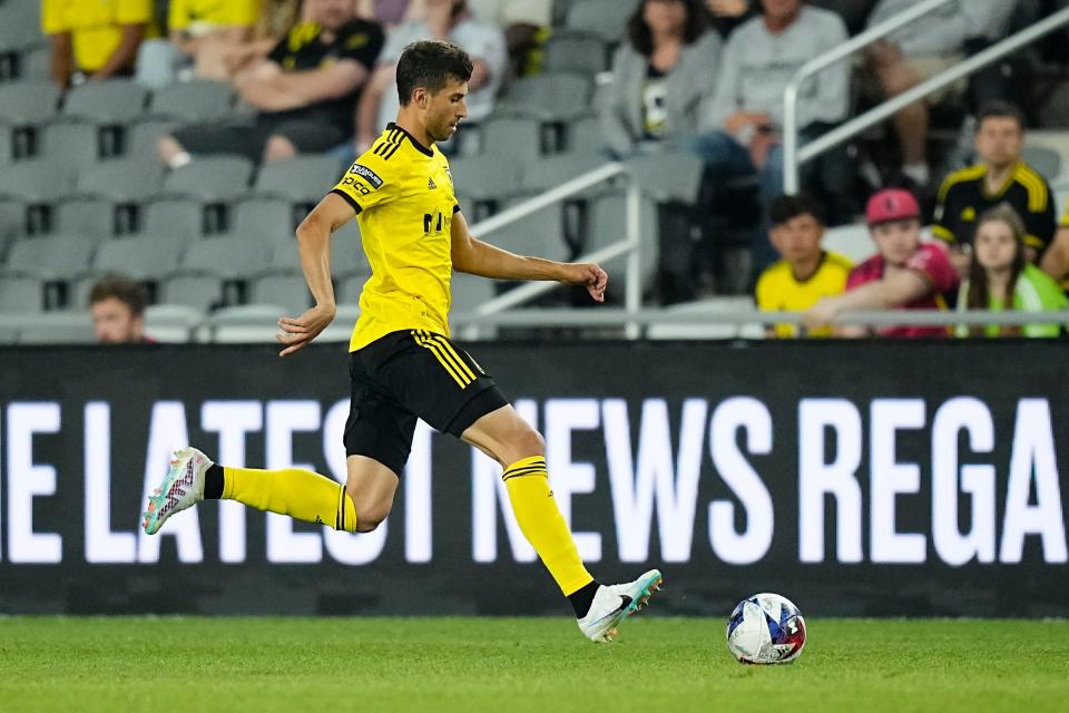 Crew defender Yevhen Cheberko dribbles against St. Louis City.