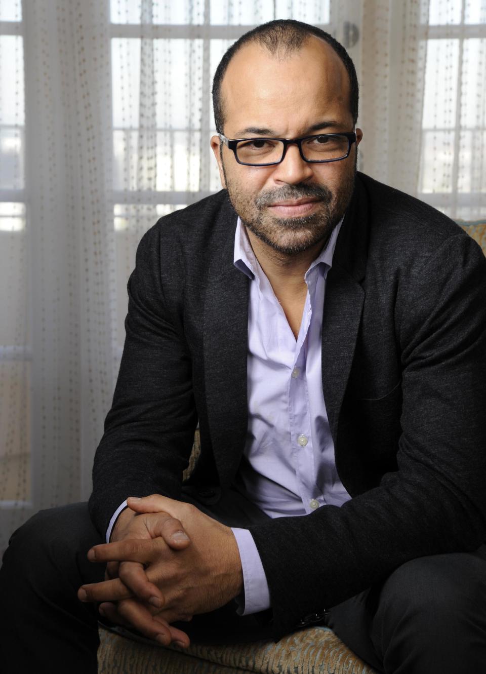 In this Friday, Nov. 8, 2013 photo, Jeffrey Wright, a cast member in "The Hunger Games: Catching Fire," poses for a portrait at the Four Seasons Hotel in Beverly Hills, Calif. Wright is one of the most versatile African-American actors of his generation. With Broadway chops, an Emmy, Golden Globe, Tony and over 35 films under his belt, including the No. 1 movie “The Hunger Games: Catching Fire,” the 47-year-old actor is far from a household name and he could care less. (Photo by Chris Pizzello/Invision/AP)