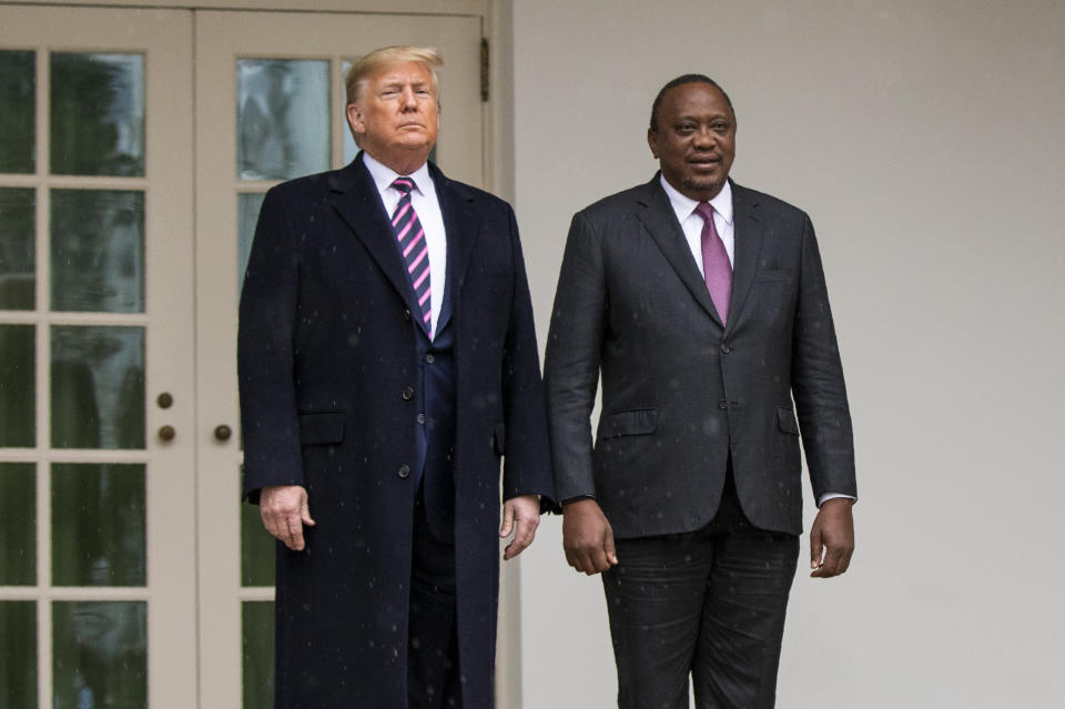 President Donald Trump stands with Kenyan President Uhuru Kenyatta as he welcomes him at the White House, Thursday, Feb. 6, 2020, in Washington. (AP Photo/Manuel Balce Ceneta)