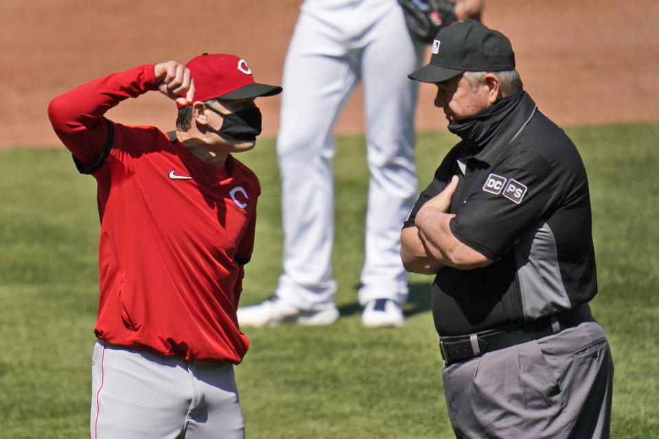 Cincinnati Reds manager David Bell, left, argues after being ejected by umpire Joe West, right, during the sixth inning of a baseball game Sunday, April 25, 2021, in St. Louis. (AP Photo/Jeff Roberson)