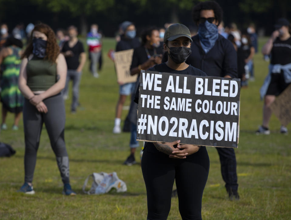 People observe social distancing as they take part in a demonstration in The Hague, Netherlands, Tuesday, June 2, 2020, to protest against the recent killing of George Floyd, police violence and institutionalized racism. Floyd, a black man, died in police custody in Minneapolis, U.S.A., after being restrained by police officers on Memorial Day. (AP Photo/Peter Dejong)