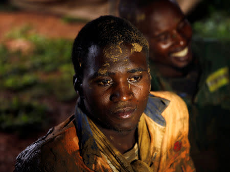 Artisanal miner Thnkmore Mandimutsa sits in a tent after being rescued as retrieval efforts proceed for trapped illegal gold miners in Kadoma, Zimbabwe, February 16, 2019. REUTERS/Philimon Bulawayo