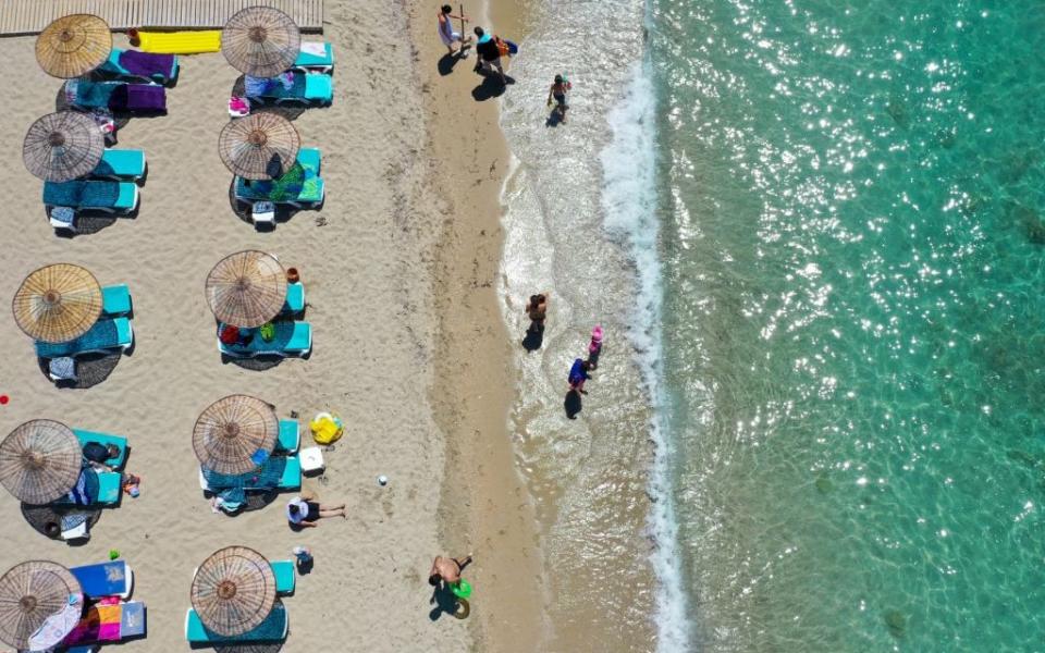 Social distancing yesterday on a beach in Izmir - getty