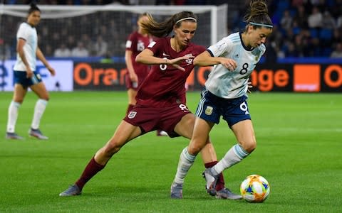 England's Jill Scott (left) battles for the ball - Credit: afp