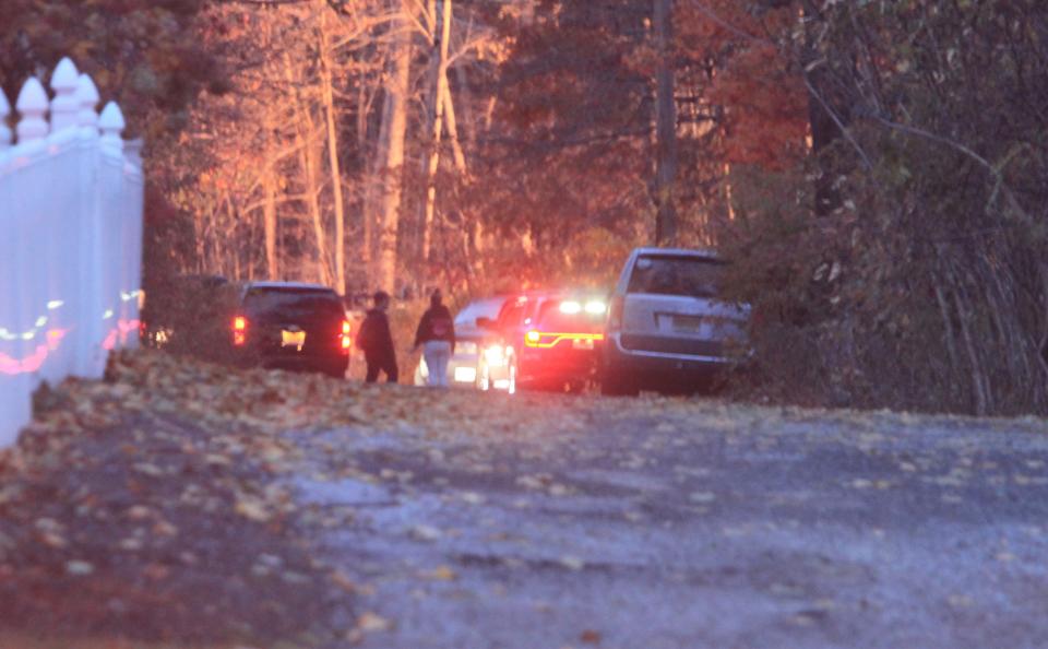 First responders are seen talking on Walnut Street near where an airplane crashed, killing two in Hampton Township on Thursday, Nov. 11, 2021.