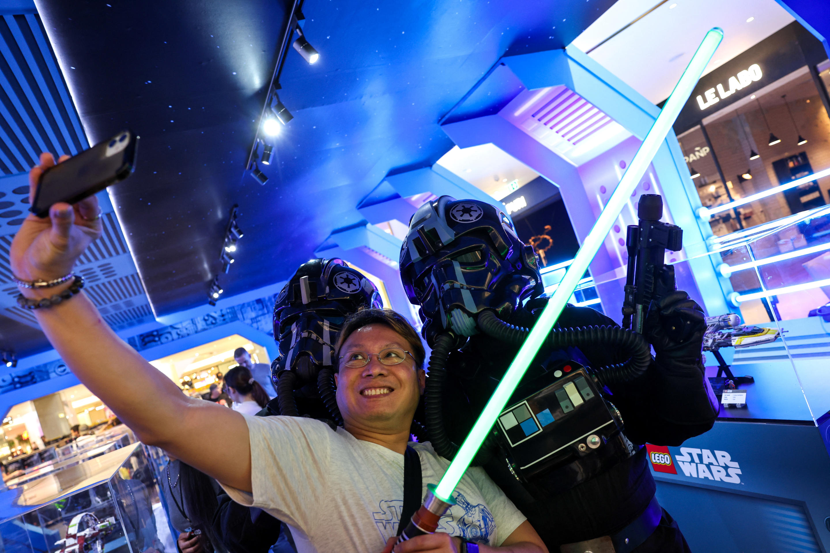 A man takes a selfie with Star Wars fans in Bangkok on May 4.