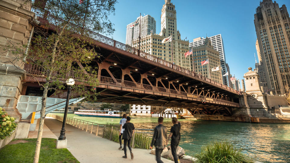 Chicago, Illinois, USA - September 22, 2018:  People walk under the DuSable Bridge over the Chicago River in downtown Chicago Illinois USA during a summer day.