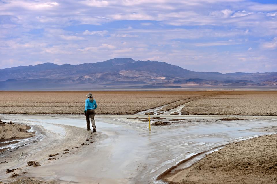 Emily Hersh checks the muddy road conditions on the Columbus Marsh, a central Nevada salt flat where her exploration company (Luna Lithium) has mining claims to extract lithium from subsurface brine on July 27, 2022.