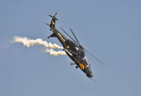 An Indian Air Force (IAF) advanced light helicopter performs during the Aero India 2015 air show at Yelahanka air base in the southern Indian city of Bengaluru February 18, 2015. REUTERS/Abhishek N. Chinnappa