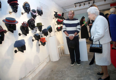 Britain's Queen Elizabeth II looks at a display during her visit at London Fashion Week, in London, Britain February 20, 2018. REUTERS/Yui Mok/Pool