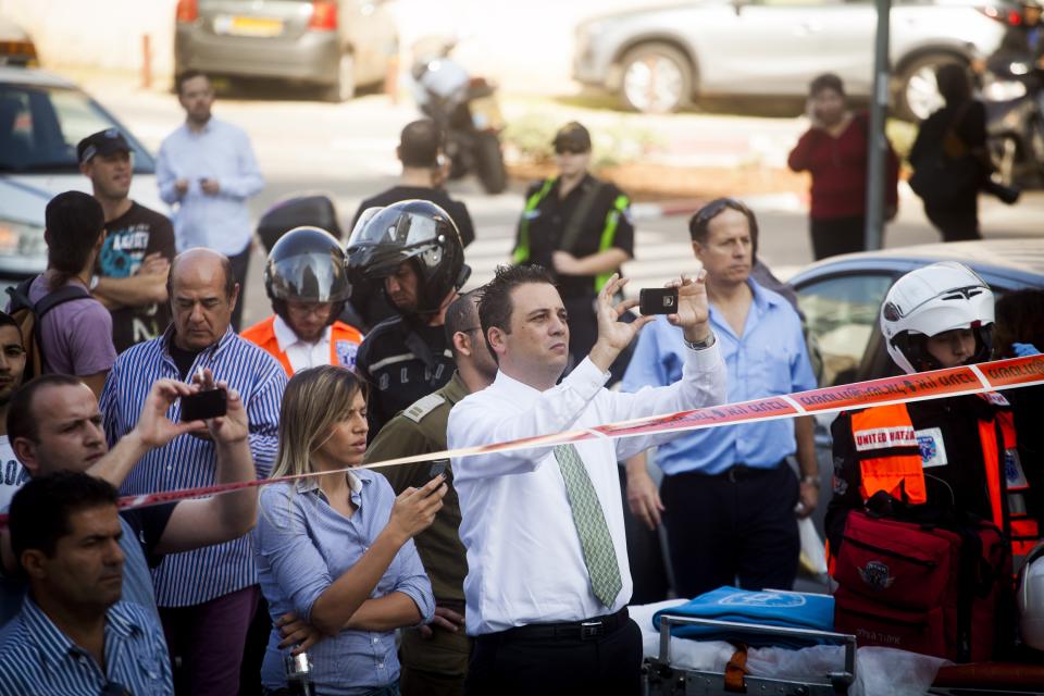 TEL AVIV, ISRAEL- NOVEMBER 21: A general view of the scene after an explosion on a bus with passengers onboard on November 21, 2012 in central Tel Aviv, Israel. At least ten people have been injured in a blast on a bus near military headquarters in what is being described as terrorist attack which threatens to derail ongoing cease-fire negotiations between Israeli and Palestinian authorities. (Photo by Ziv Oren/Getty Images)