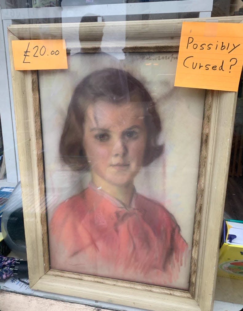 image of the painting with a sticky note reading "possibly cursed?"