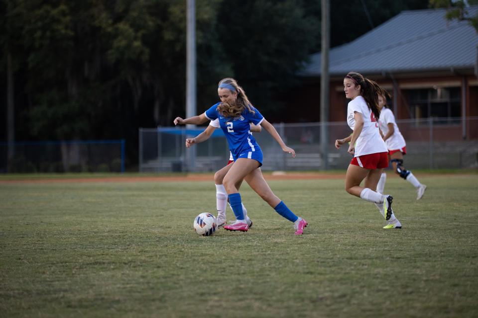 St. Andrew's senior Sydney Minton plays the ball upfield in a state semifinal win over Deerfield-Windsor Wednesday.