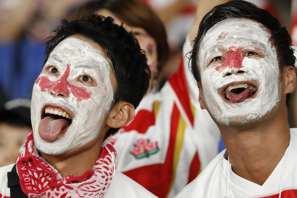 CORRECTS MATCH TEAM - Japan team's fans wait for the start of the the Rugby World Cup Pool A game at International Stadium between Japan and Scotland in Yokohama, Japan, Sunday, Oct. 13, 2019.(AP Photo/Eugene Hoshiko)