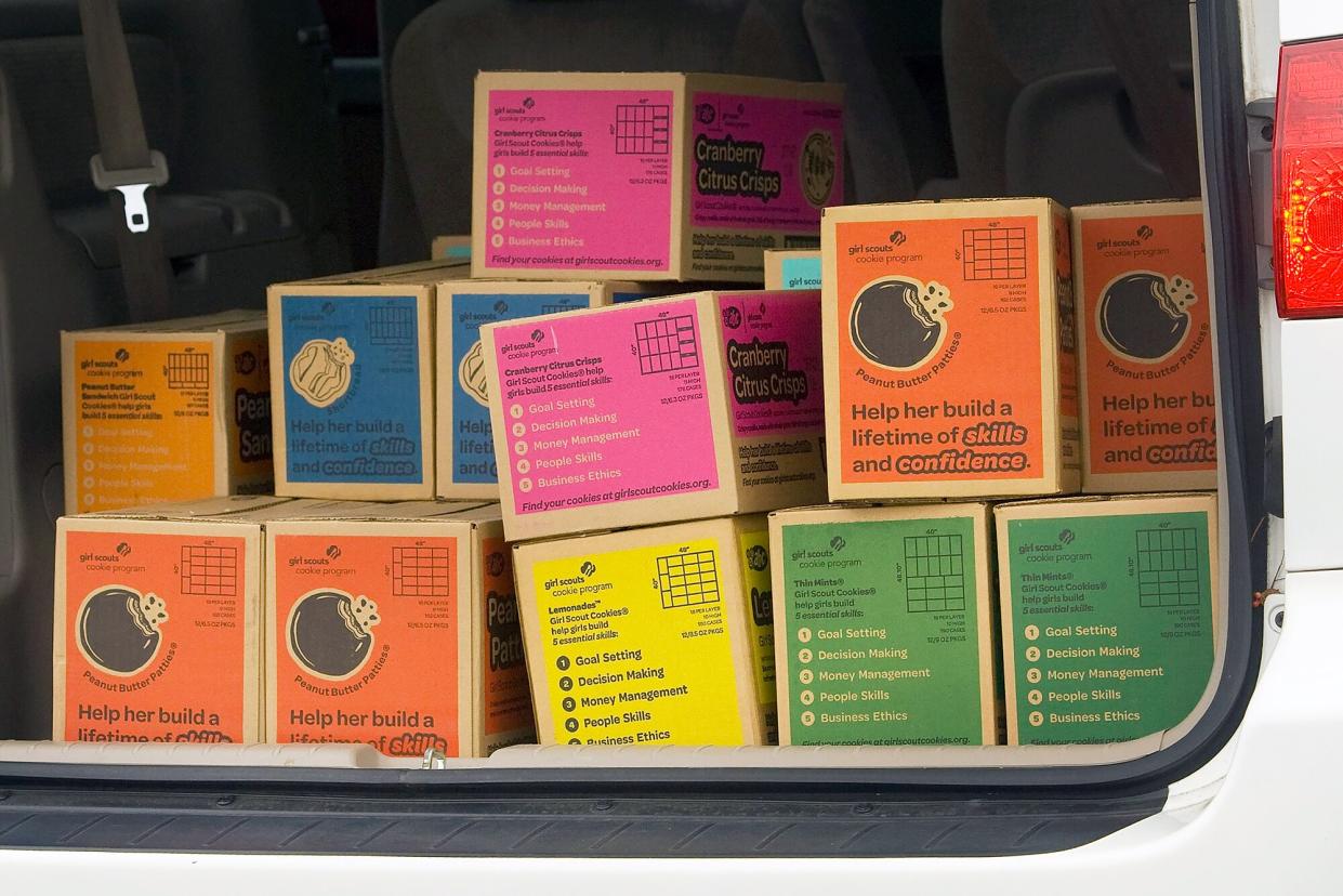 Boxes of Girl Scout Cookies in transport