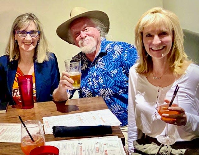 Travel writers Sherry Spitsnaugle, Rich Grant and Janna Graber toast the Mile High City at the 5280 Burger Bar in Denver.