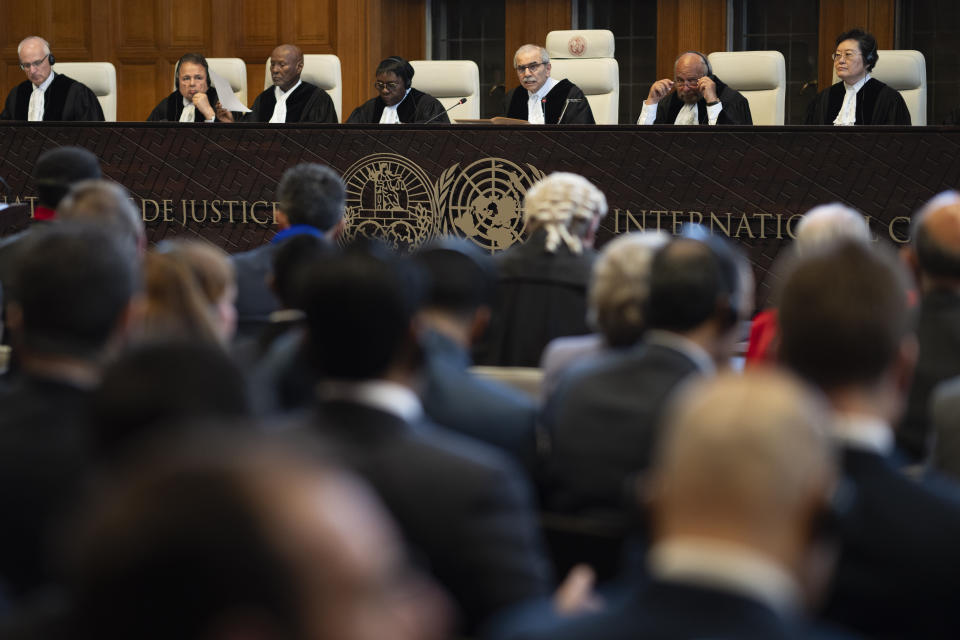 Presiding judge Nawaf Salam, third from right, opens the hearings at the International Court of Justice, in The Hague, Netherlands, Thursday, May 16, 2024. The U.N.'s top court opened two days of hearings in a case brought by South Africa to see whether Israel needs to take additional measures to alleviate the suffering in war-ravaged Gaza. (AP Photo/Peter Dejong)