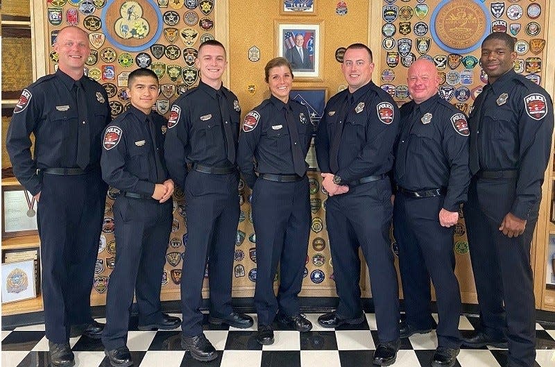 Former Washington High School quarterback Colton Marshall (third from right), who survived the EF-4 tornado that hit the town in 2013, is now a police officer in Murfreesboro, Tenn.