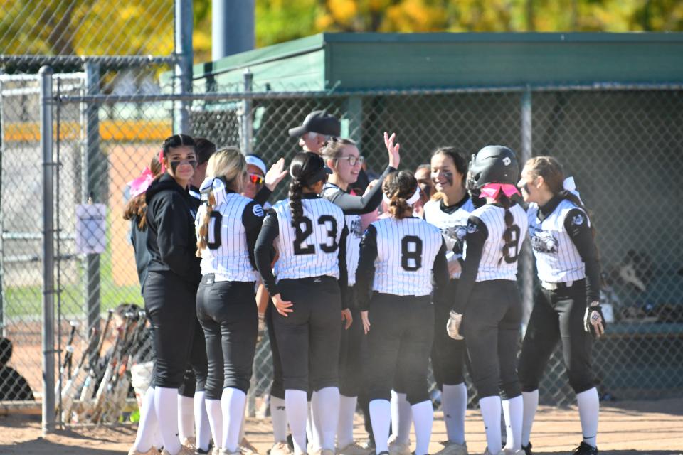 Pueblo South's softball team celebrates a victory over Coronado in a 2021 game.