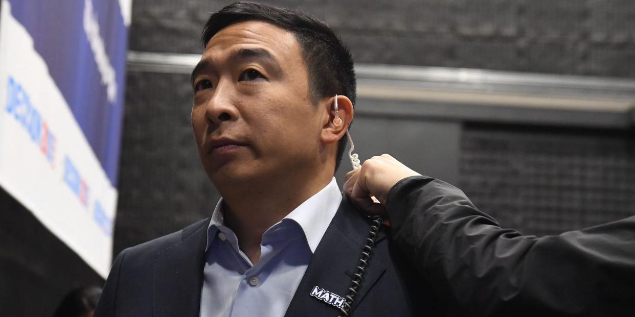 Andrew Yang, wearing a "MATH" (Make America Think Harder) pin