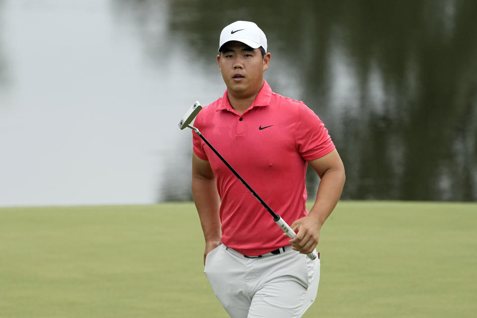 Tom Kim walks on the ninth green during the first round of the St. Jude Championship golf tournament Thursday, Aug. 10, 2023, in Memphis, Tenn. (AP Photo/George Walker IV)
