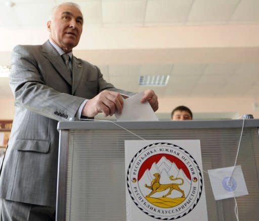 Former local head of the KGB security service Leonid Tibilov casts his ballot at a polling station in Tskhinvali. Tibilov was declared winner Monday of a leadership ballot in Georgia's rebel pro-Russian region of South Ossetia that was held after two earlier polls ended in turmoil