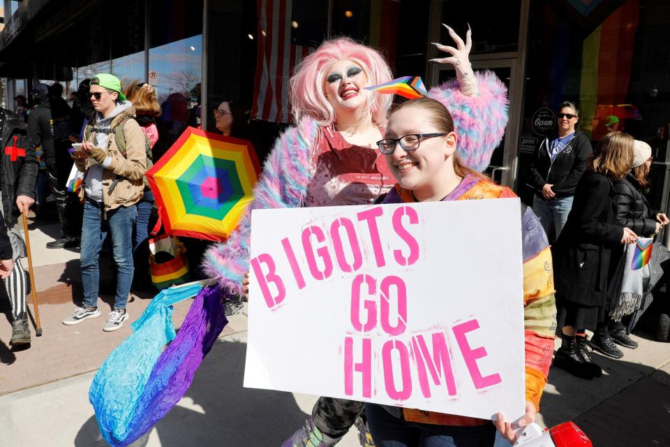 Pro- and anti-drag queen protesters rally outside a book store's Drag Queen Story Time in Royal Oak, Mich., on March 11, 2023.