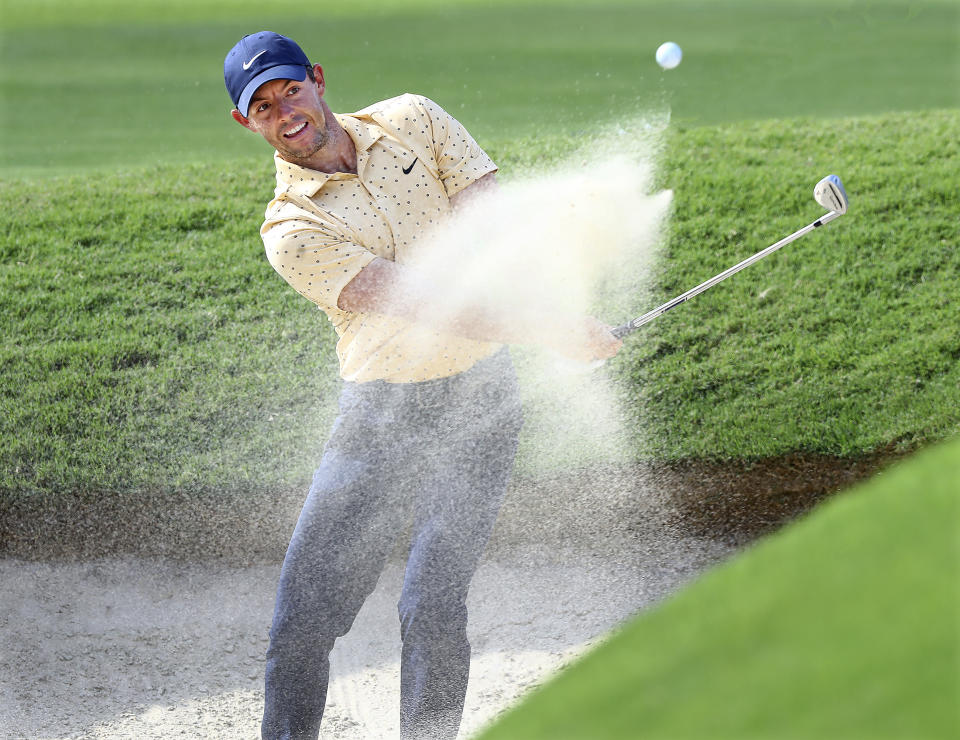 Rory McIIroy hits from the bunker to the 18th green during the first round of the Tour Championship golf tournament at East Lake Golf Club, Friday, Sept. 4, 2020, in Atlanta. (Curtis Compton/Atlanta Journal-Constitution via AP)
