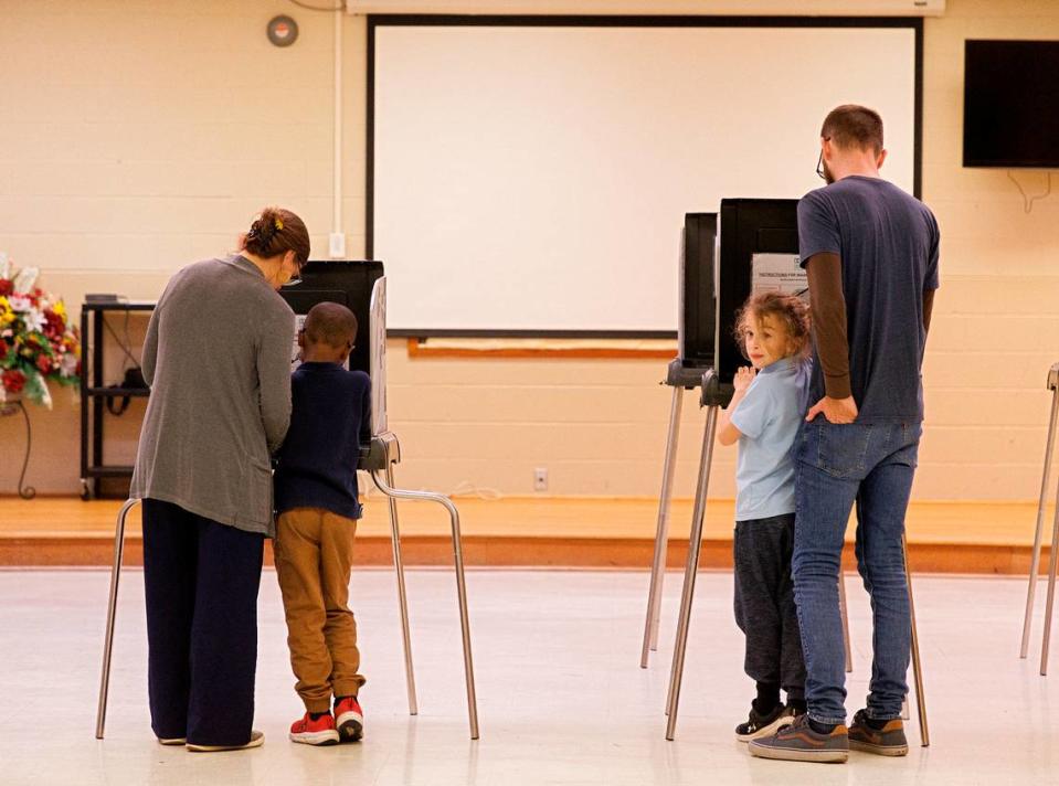 Laura Klein and Andrew Witkins vote with their children, Prince, 6, and Otis, 8, at White Rock Baptist Church on Tuesday, March 5, 2024, in Durham, N.C. Kaitlin McKeown/kmckeown@newsobserver.com