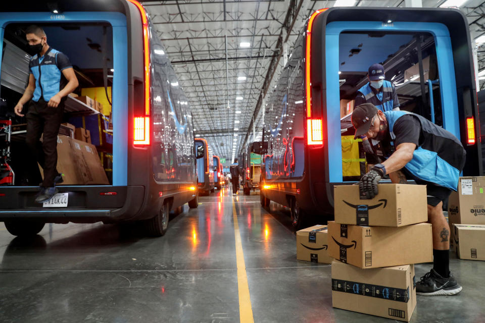 Amazon workers loading trucks