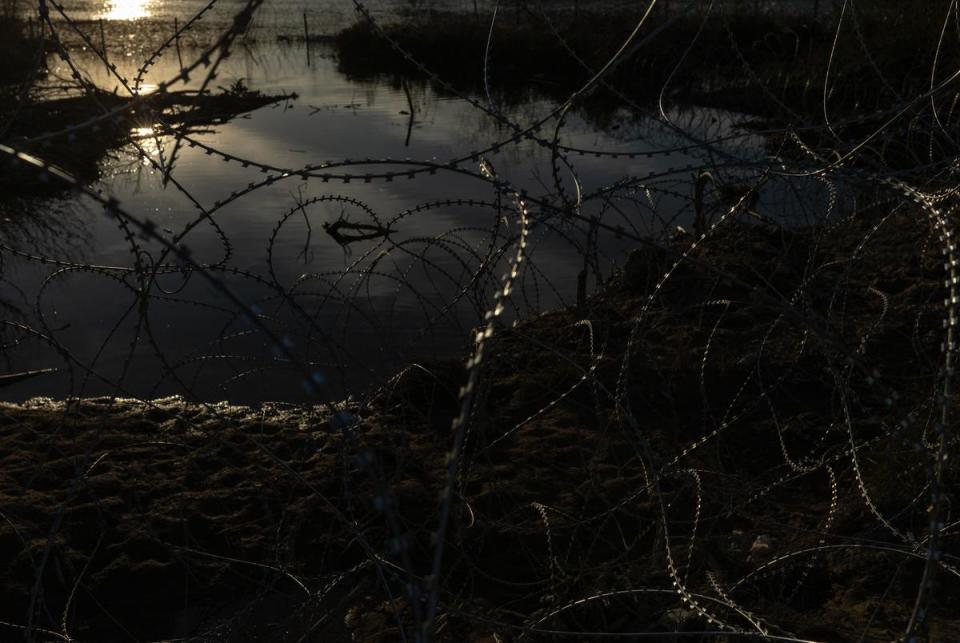 The bank of the Rio Grande is fenced with concertina wire at Eagle Pass, on Jan. 16, 2024. Texas has closed off Shelby Park, cutting access to federal agents to part of the Texas-Mexico border and escalating tensions between the Biden administration and Gov. Greg Abbott.