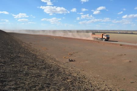 FILE PHOTO: A truck transports coals to the Chinese border in Tsogttsetsii, Mongolia, June 12, 2017. REUTERS/Terrence Edwards