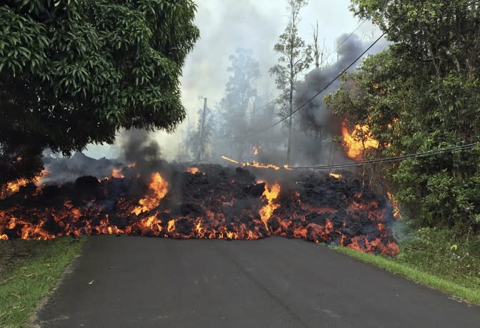 A lava flow crosses Makamae Street in Leilani Estates. (USGS / Reuters)