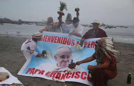 Peruvian shamans perform a ritual prior to the arrival of Pope Francis to Peru, at Pescadores beach in Chorrillos, Lima, Peru January 17, 2018. REUTERS/Guadalupe Pardo