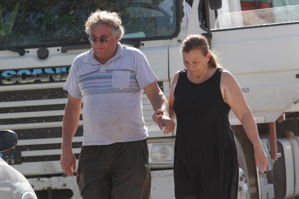 Horacio Sala, father of Emiliano Sala, holds hands with his partner Liliana outside their home in Progreso, Argentina (AP)