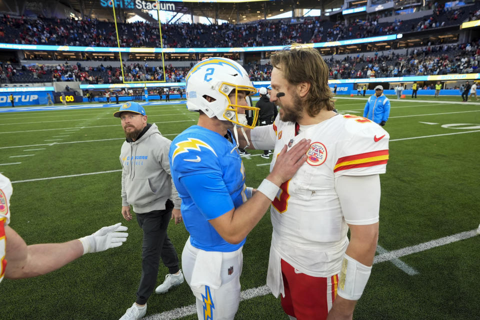 Los Angeles Chargers quarterback Easton Stick, left, greets Kansas City Chiefs quarterback Blaine Gabbert after the Chiefs defeated the Chargers 13-12 in an NFL football game, Sunday, Jan. 7, 2024, in Inglewood, Calif. (AP Photo/Mark J. Terrill)