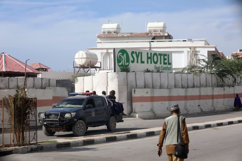 Somali security forces are positioned outside the SYL hotel after taking it over from Al Shabaab gunmen, who lunched an attack on the hotel near the presidential residence in Mogadishu