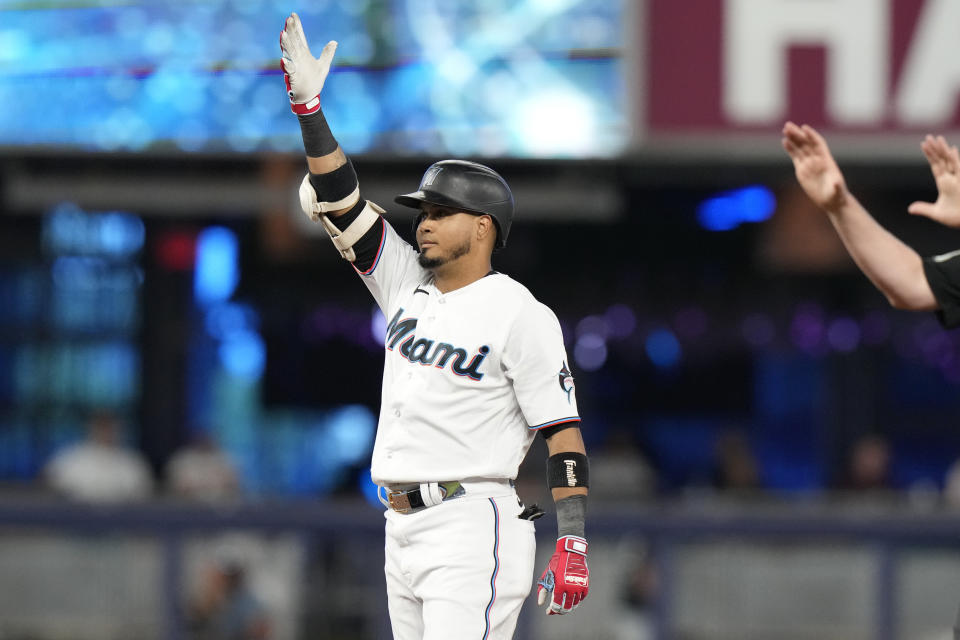 Miami Marlins' Luis Arraez reacts after hitting a double against the St. Louis Cardinals during the first inning of a baseball game Wednesday, July 5, 2023, in Miami. (AP Photo/Lynne Sladky)