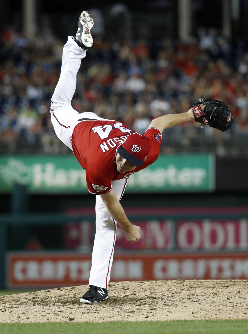 Washington Nationals reliever Ryan Madson watches a pitch during the eighth inning of the second baseball game of a doubleheader against the Cincinnati Reds at Nationals Park, Saturday, Aug. 4, 2018, in Washington. The Nationals won 6-2. (AP Photo/Alex Brandon)