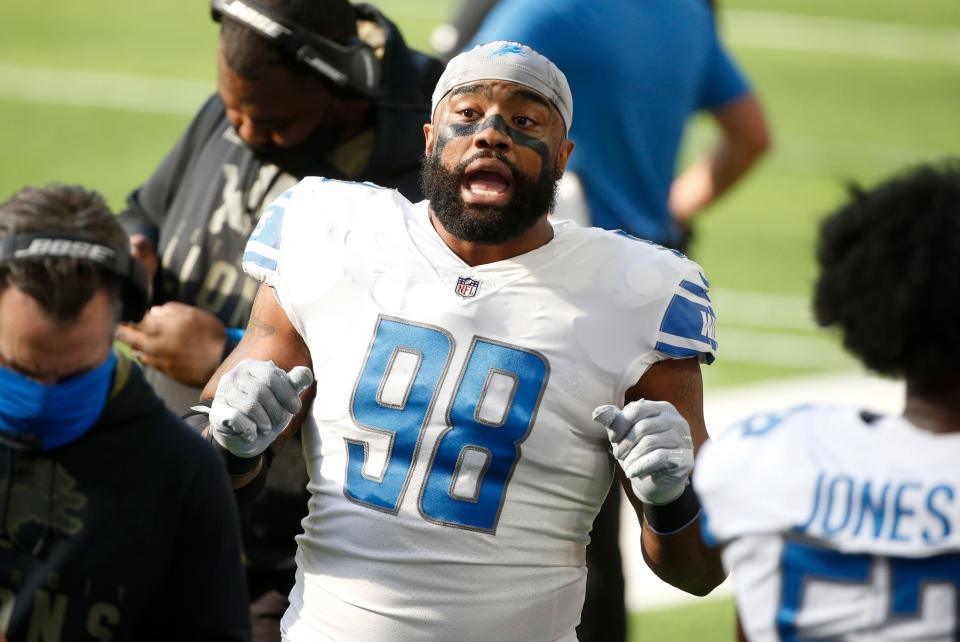 Detroit Lions defensive end Everson Griffen talks with teammates on the sideline during the first half of an NFL football game against the Minnesota Vikings, Sunday, Nov. 8, 2020, in Minneapolis. (AP Photo/Bruce Kluckhohn)