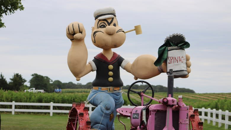 statue of Popeye eating spinach 