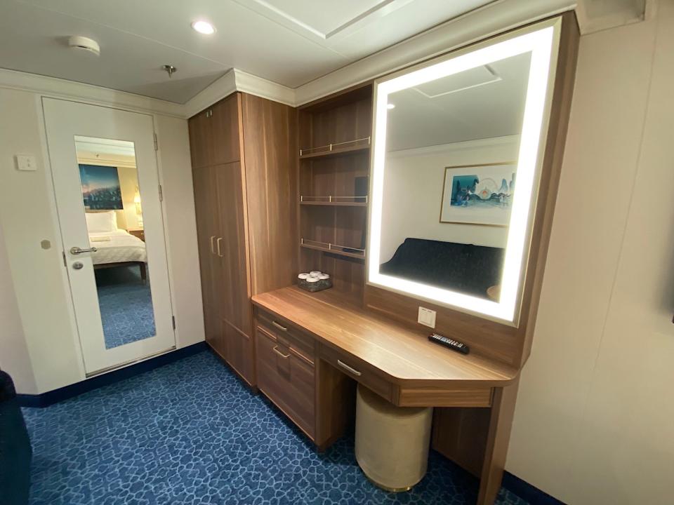 The closet and vanity found in the inside stateroom aboard the Disney Wish.