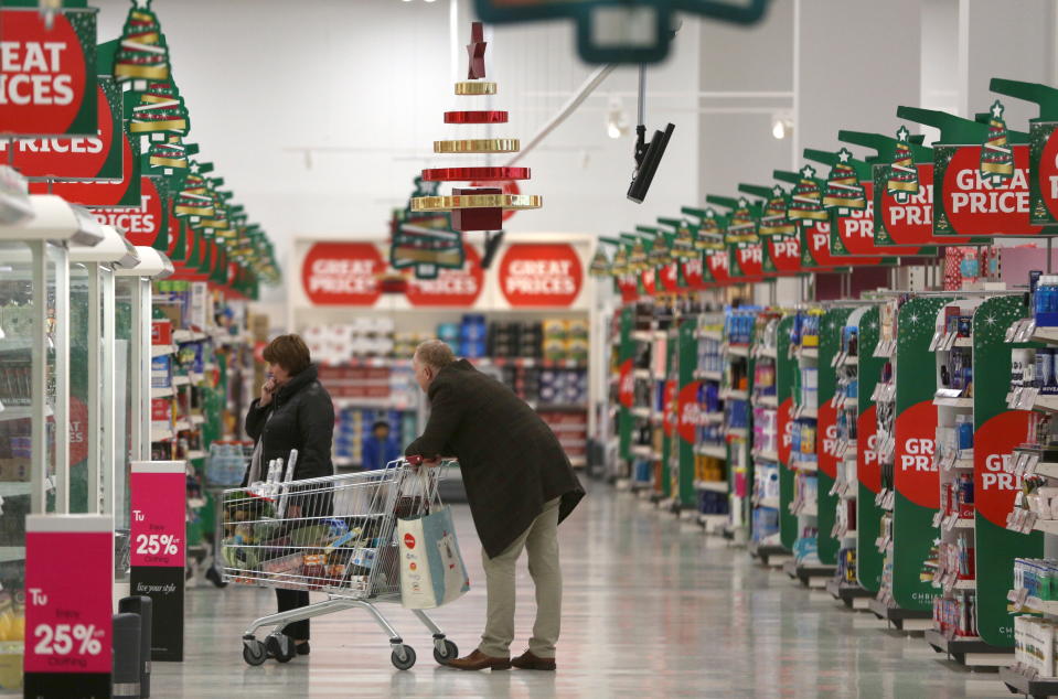 Customers shop at a Sainsbury's store in London, Britain December 3, 2015. Britons will spend 20.3 billion pounds ($31 billion) on groceries over the festive period, a 1.4 percent increase on last year, industry research group IGD forecast on Wednesday. The group said its research found 19 percent of shoppers plan to spend more on food and drink over the Christmas period, defined as Nov. 20 to Dec. 26, than the previous Christmas, a trend which could be positive for the likes of market leaders Tesco and Sainsbury. REUTERS/Neil Hall