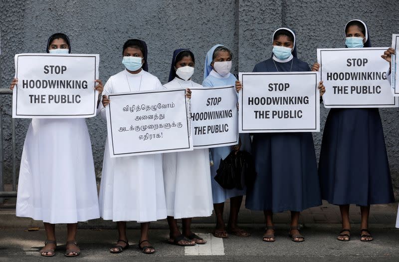 Catholic nuns hold placards against Sri Lanka's President Rajapaksa in Colombo